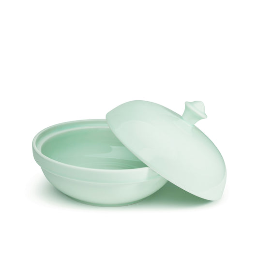 10" green celadon porcelain serving bowl with cover, cover on the side, front view, media 1 of 5